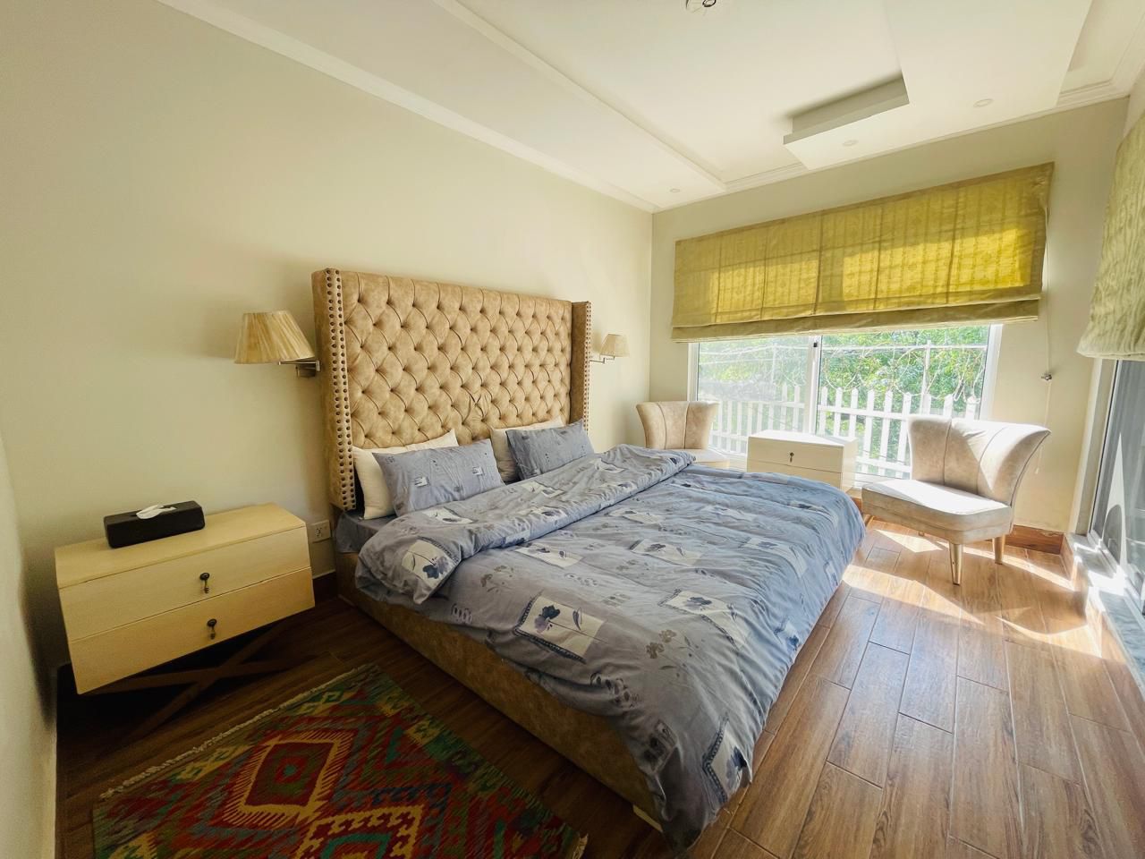 second cottage bedroom with excellent natural light, comfortable furnishings, modern decor, mountain cottage aesthetic